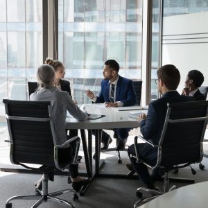 business people negotiating in modern boardroom business people negotiating in modern boardroom